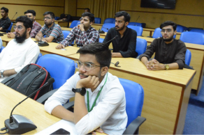 Umair Farooq attending a digital skills training session in Karachi with young professionals at Sindh Madrasa Islam University